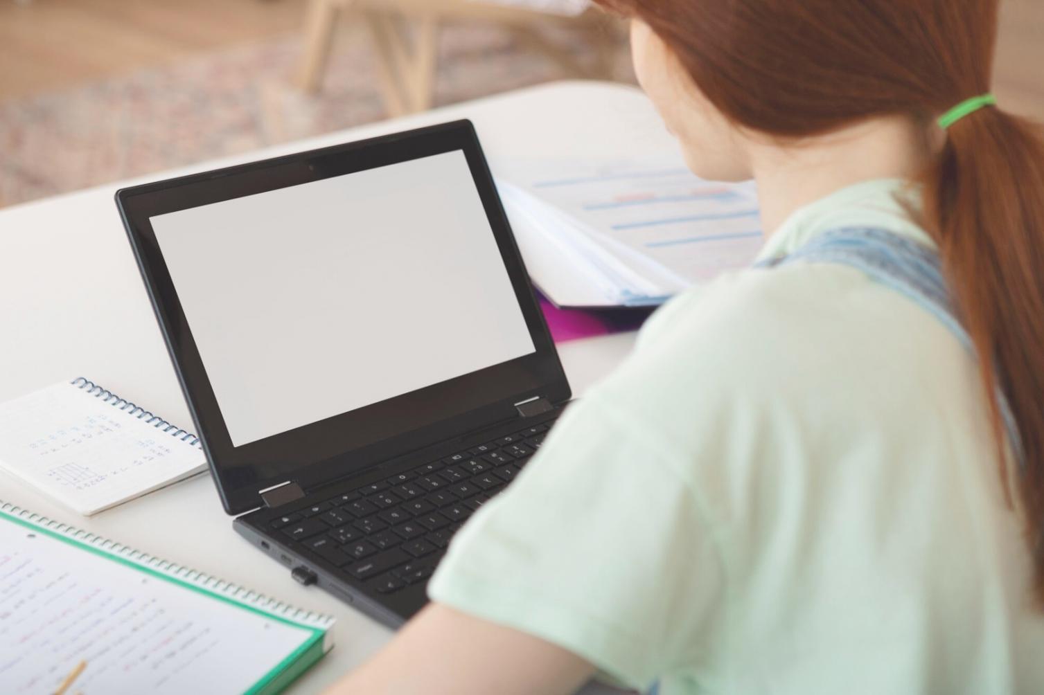 Financial data analysis workspace with charts and research materials